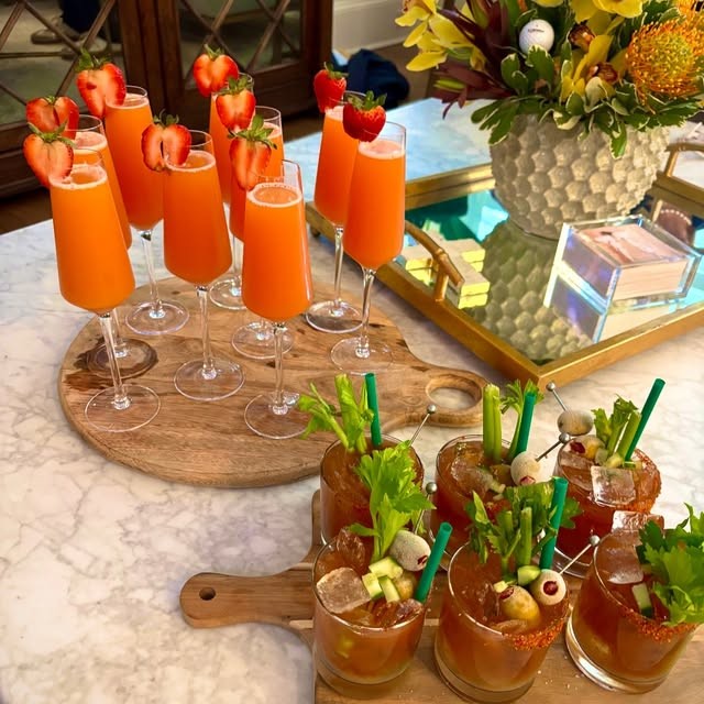 A brunch bar of garnished orange spritzes and bloody marys